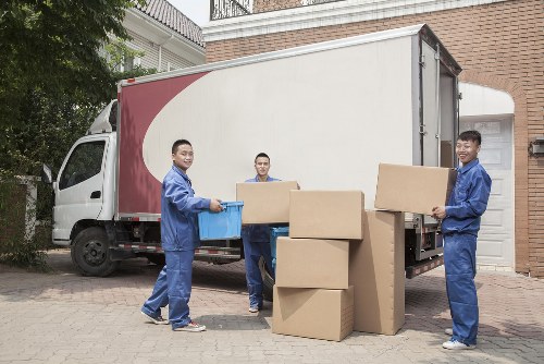 Professional harrow removals team handling furniture
